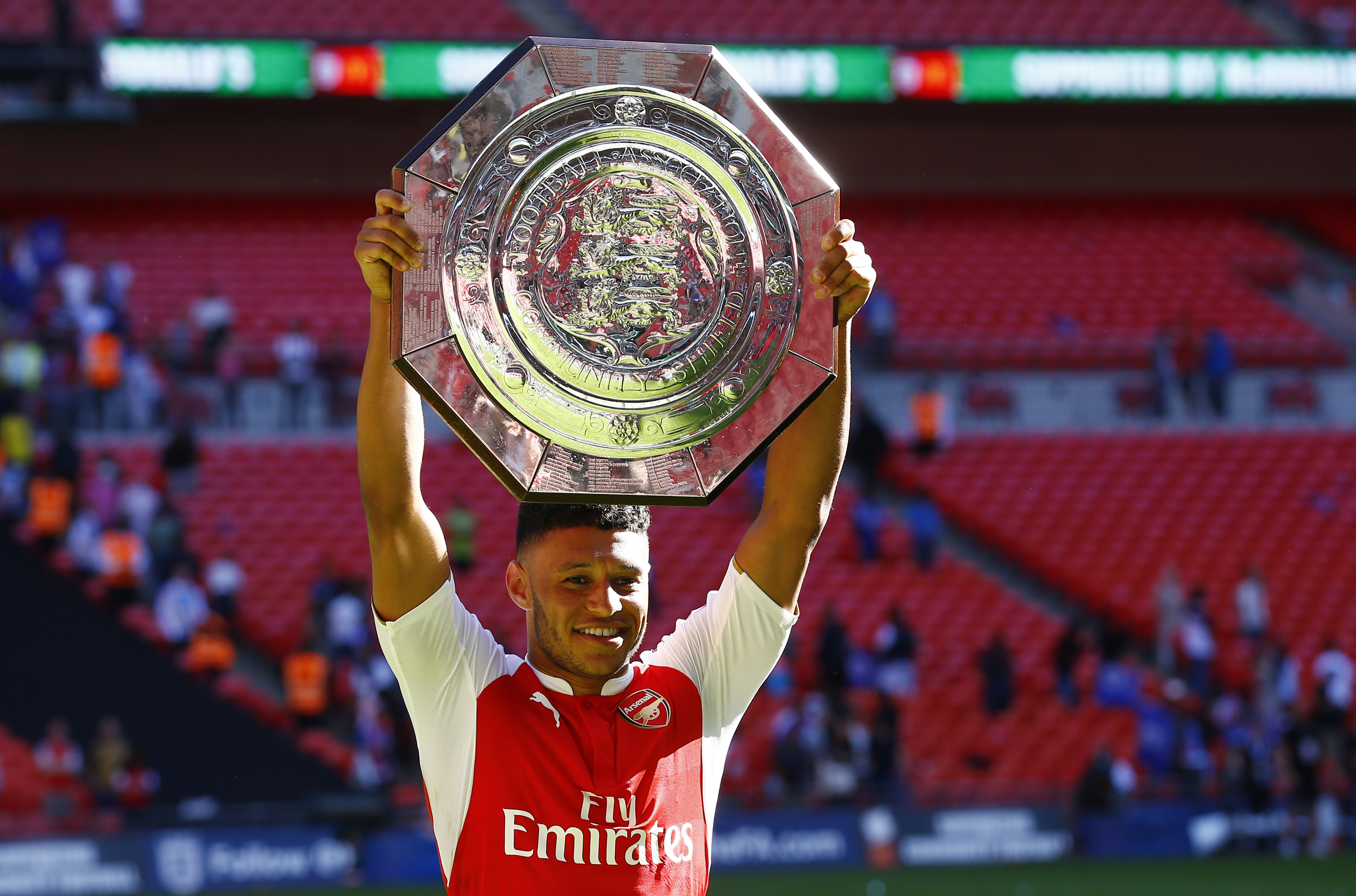 Football - Chelsea v Arsenal - FA Community Shield - Wembley Stadium - 2/8/15 Arsenal's Alex Oxlade Chamberlain celebrates with the trophy after winning the FA Community Shield - (c) Reuters / Darren Staples Livepic 