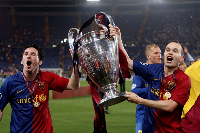 Football - Manchester United v FC Barcelona 2009 Champions League Final - Olympic Stadium, Rome, Italy - 27/5/09 Barcelona's Lionel Messi and Andres Iniesta celebrate victory with the trophy Mandatory Credit: Action Images / Lee Smith Livepic